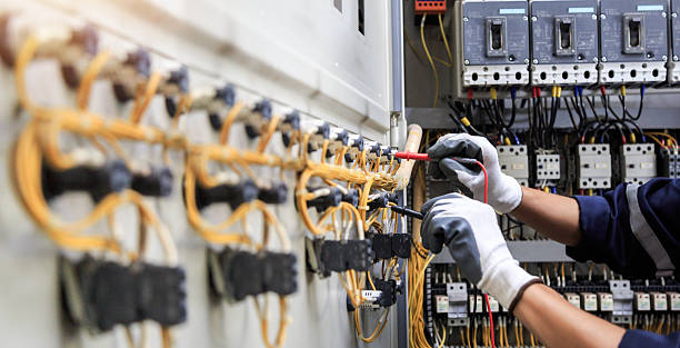 Professional Electrical Panel Upgrade technician working in Clay County County, IA